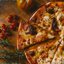 A pequena cidade produz mais de 600 pizzas por mês. - Foto: Unsplash